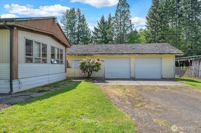 315 Washington St, Pe Ell, WA 98572 - view of property exterior with a detached garage and an outbuilding