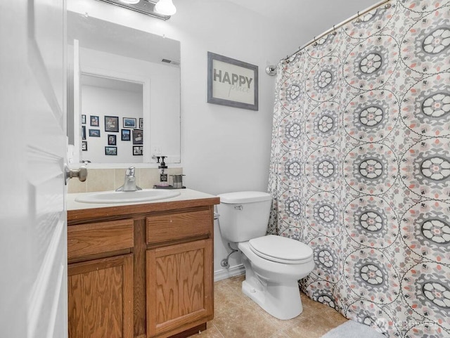 530 N Kentucky Dr, Moses Lake, WA 98837 - full bathroom with vanity, toilet, tile patterned flooring, and a shower with curtain