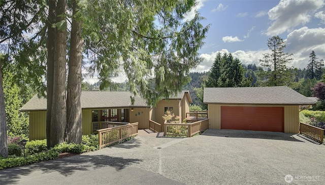 9430 Hoeder Ln, Bothell, WA 98011 - view of front of property with driveway, a shingled roof, and an attached garage