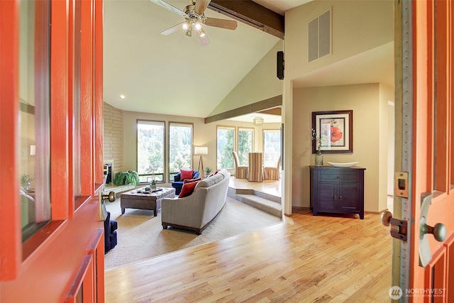 9430 Hoeder Ln, Bothell, WA 98011 - living room with beam ceiling, light wood-style floors, a ceiling fan, and high vaulted ceiling