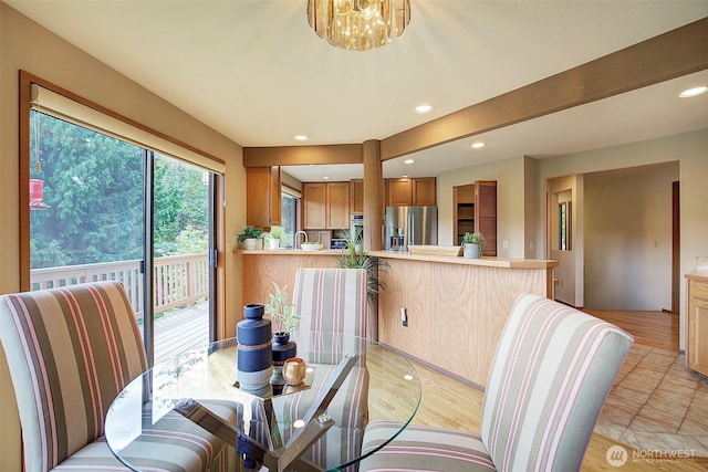 9430 Hoeder Ln, Bothell, WA 98011 - dining area with recessed lighting, light tile patterned flooring, and a chandelier