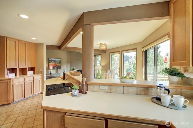 9430 Hoeder Ln, Bothell, WA 98011 - kitchen with black electric cooktop, plenty of natural light, light countertops, light tile patterned floors, and recessed lighting