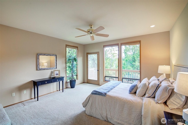 9430 Hoeder Ln, Bothell, WA 98011 - carpeted bedroom featuring access to outside, multiple windows, baseboards, and a ceiling fan