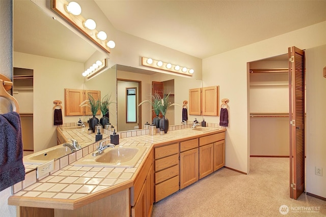 9430 Hoeder Ln, Bothell, WA 98011 - full bathroom featuring double vanity, baseboards, and a spacious closet
