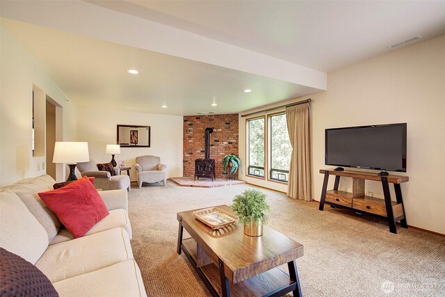 9430 Hoeder Ln, Bothell, WA 98011 - living area featuring a wood stove, carpet, recessed lighting, and baseboards