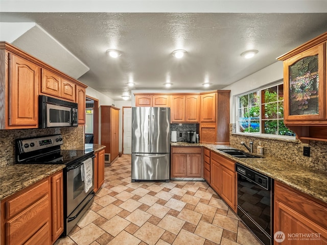 271 E Ballantrae Dr, Shelton, WA 98584 - kitchen featuring stainless steel appliances, backsplash, a sink, and dark stone counters