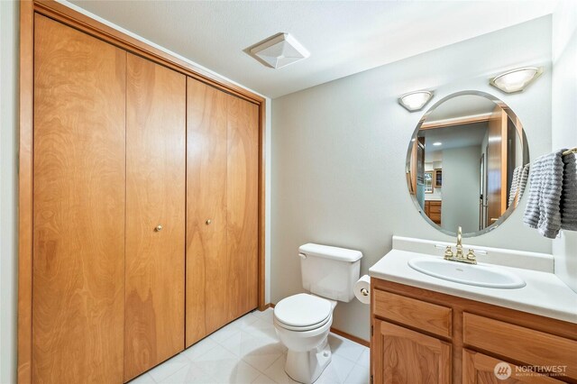 84 Norling Ln, Leavenworth, WA 98826 - bathroom with vanity, toilet, baseboards, and a closet