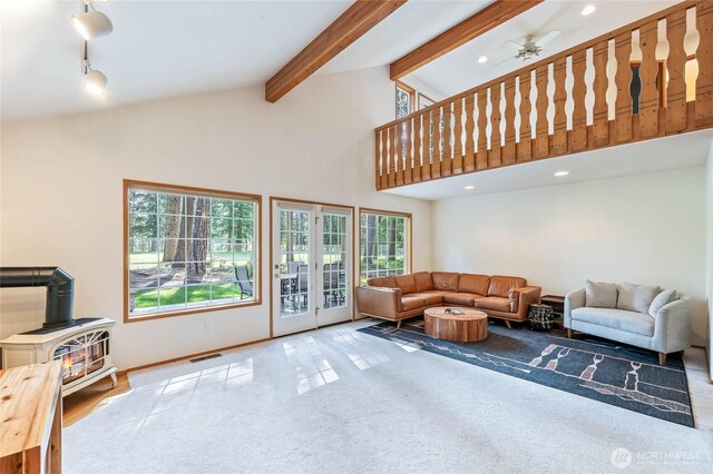 84 Norling Ln, Leavenworth, WA 98826 - living room with a wood stove, carpet floors, high vaulted ceiling, beamed ceiling, and a ceiling fan