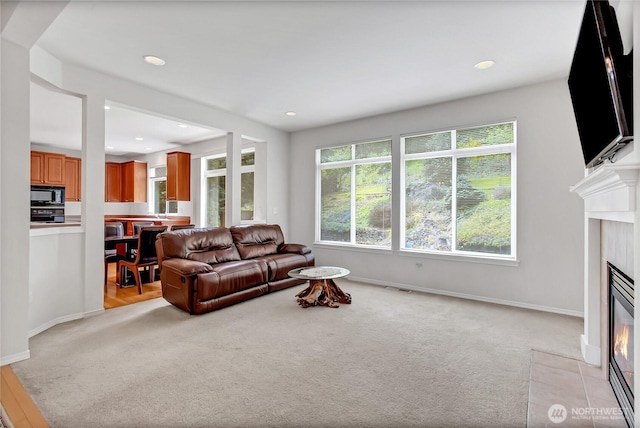 8130 104th Street Ct SW, Lakewood, WA 98498 - living room with light carpet, a fireplace, baseboards, and recessed lighting