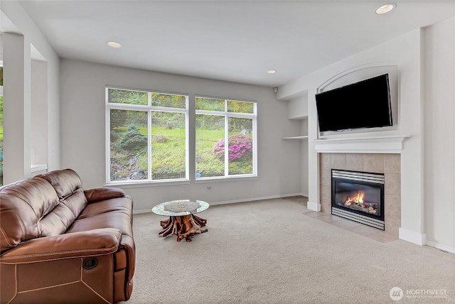 8130 104th Street Ct SW, Lakewood, WA 98498 - carpeted living area with a tile fireplace, baseboards, and recessed lighting