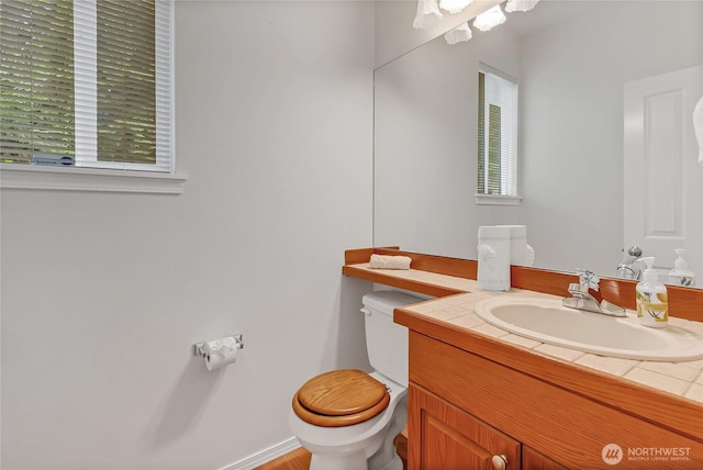 8130 104th Street Ct SW, Lakewood, WA 98498 - bathroom featuring toilet, plenty of natural light, and vanity