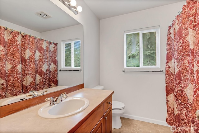 8130 104th Street Ct SW, Lakewood, WA 98498 - full bathroom featuring vanity, toilet, baseboards, and a shower with curtain