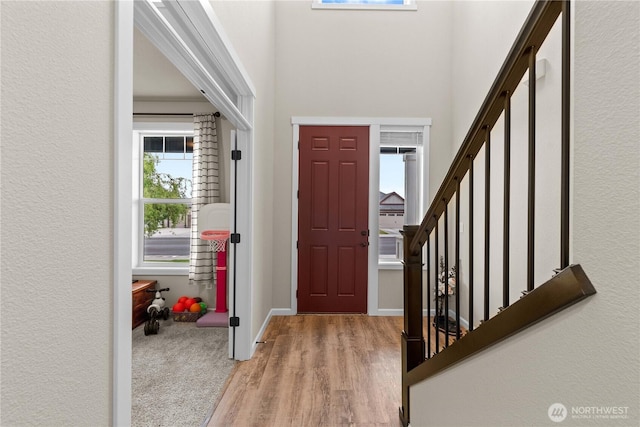 509 L NE, Quincy, WA 98848 - entryway featuring stairs, light wood-style flooring, and a towering ceiling