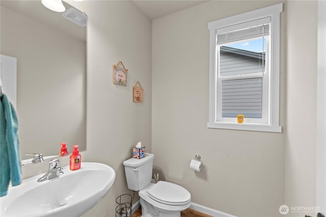 509 L NE, Quincy, WA 98848 - bathroom with a sink, toilet, and baseboards