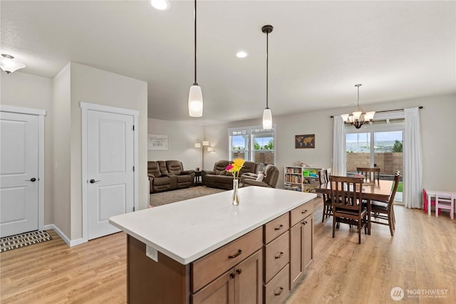 509 L NE, Quincy, WA 98848 - kitchen with light wood finished floors, a chandelier, hanging light fixtures, light countertops, and recessed lighting