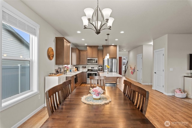 509 L NE, Quincy, WA 98848 - dining space featuring baseboards, a chandelier, light wood-type flooring, and recessed lighting