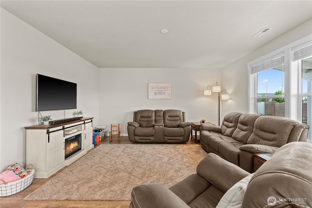 509 L NE, Quincy, WA 98848 - living area with wood finished floors, baseboards, and a glass covered fireplace