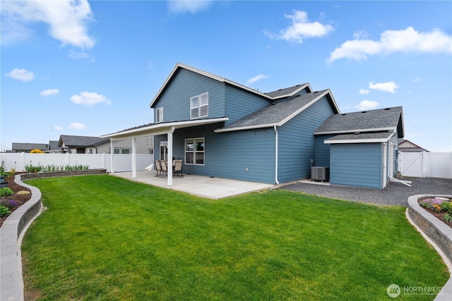 509 L NE, Quincy, WA 98848 - rear view of house featuring a patio area, central air condition unit, and a shingled roof