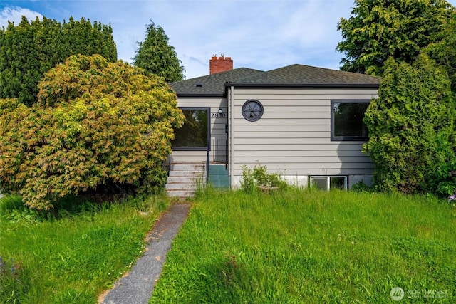 2830 Elm St, Bellingham, WA 98225 - view of front of home with a chimney and a shingled roof