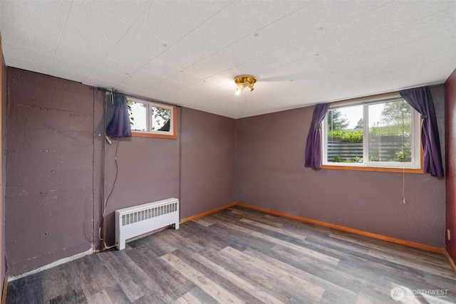 2830 Elm St, Bellingham, WA 98225 - basement with radiator heating unit, wood finished floors, and baseboards