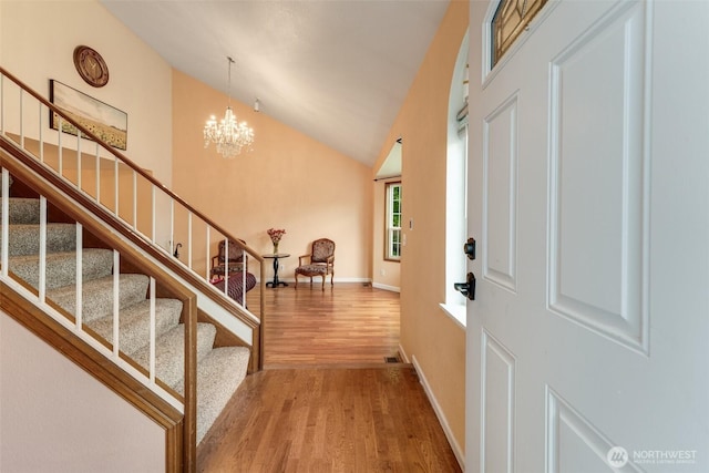 12903 SE 282nd Way, Kent, WA 98030 - foyer entrance featuring wood finished floors, stairs, a chandelier, baseboards, and high vaulted ceiling