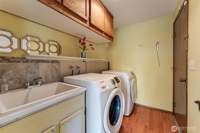12903 SE 282nd Way, Kent, WA 98030 - laundry area featuring cabinet space, light wood-style floors, and separate washer and dryer