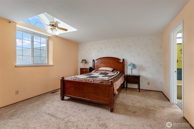 12903 SE 282nd Way, Kent, WA 98030 - carpeted bedroom with a skylight, a ceiling fan, wallpapered walls, and baseboards