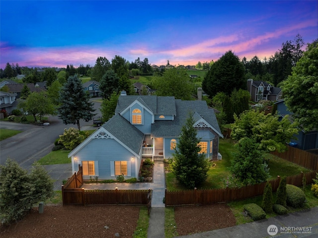 12903 SE 282nd Way, Kent, WA 98030 - victorian-style house featuring a fenced front yard, a chimney, roof with shingles, and a porch