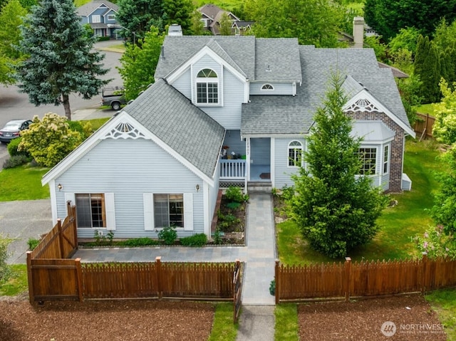 12903 SE 282nd Way, Kent, WA 98030 - view of front of property featuring roof with shingles, a chimney, and a fenced front yard