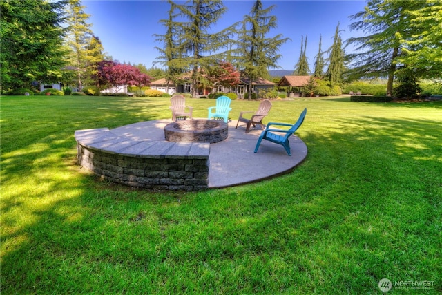 11504 128th Dr NE, Lake Stevens, WA 98258 - view of grassy yard with an outdoor fire pit and a patio area