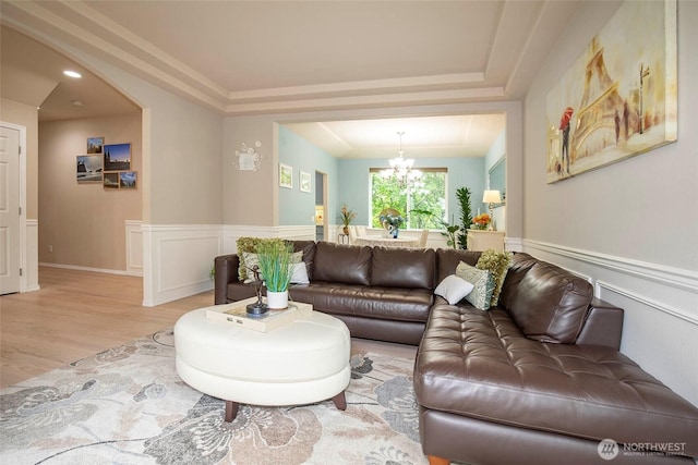 19 198th Pl SE, Bothell, WA 98012 - living room featuring a chandelier, light wood-style floors, wainscoting, and a decorative wall