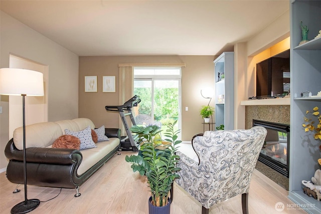 19 198th Pl SE, Bothell, WA 98012 - living room featuring light wood-style floors and a glass covered fireplace