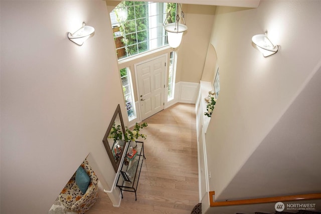 19 198th Pl SE, Bothell, WA 98012 - foyer entrance featuring wood finished floors, wainscoting, and a decorative wall