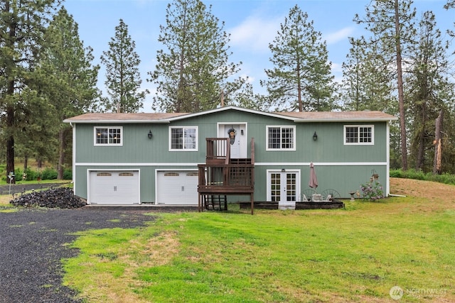 4224 N Brooks Rd, Medical Lake, WA 99022 - back of house with a yard, driveway, french doors, and an attached garage