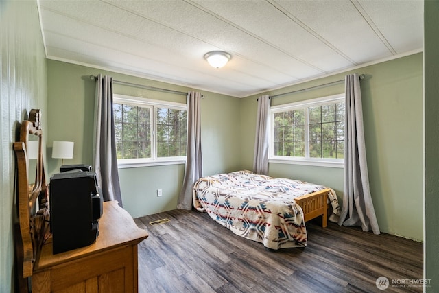 4224 N Brooks Rd, Medical Lake, WA 99022 - bedroom with dark wood finished floors, ornamental molding, and a textured ceiling