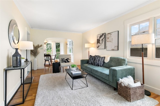 3929 SW Elmgrove St, Seattle, WA 98136 - living area with arched walkways, ornamental molding, wood finished floors, and baseboards