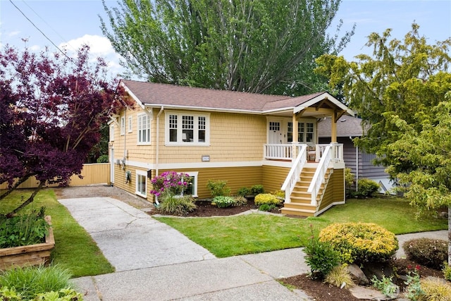3929 SW Elmgrove St, Seattle, WA 98136 - view of front facade with stairway, concrete driveway, and roof with shingles