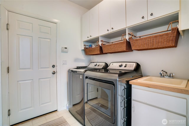 13302 53rd Ave NW, Gig Harbor, WA 98332 - laundry room with cabinet space, washing machine and clothes dryer, and light tile patterned flooring
