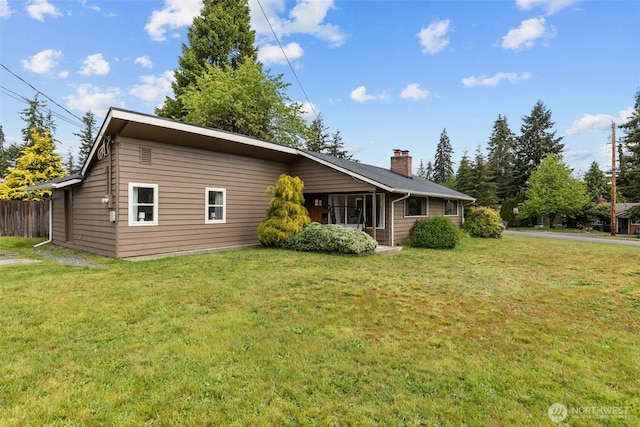 5003 219th St SW, Mountlake Terrace, WA 98043 - view of property exterior featuring a lawn and a chimney