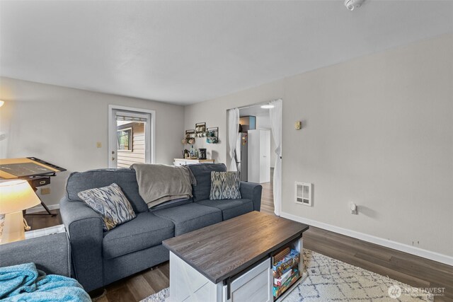 5003 219th St SW, Mountlake Terrace, WA 98043 - living room featuring baseboards and dark wood-style floors