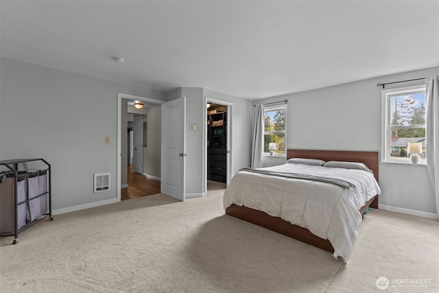 5003 219th St SW, Mountlake Terrace, WA 98043 - bedroom featuring carpet floors, baseboards, a walk in closet, and a closet