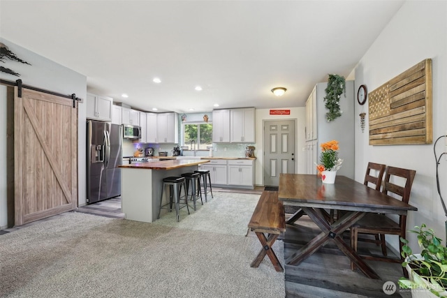 822 Filbert Rd, Cle Elum, WA 98922 - dining area with a barn door, recessed lighting, and light carpet