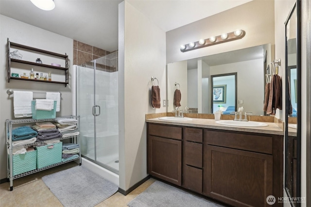 822 Filbert Rd, Cle Elum, WA 98922 - bathroom featuring a shower stall, double vanity, and tile patterned floors