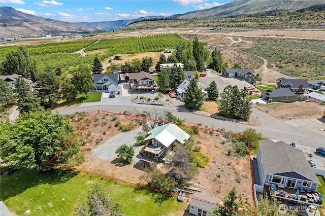 245 Lakeview Ave, Orondo, WA 98843 - aerial view of sparsely populated area featuring a mountain backdrop, property parcel outlined, and nearby suburban area