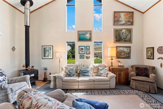 245 Lakeview Ave, Orondo, WA 98843 - living room featuring carpet flooring, a wood stove, high vaulted ceiling, and crown molding