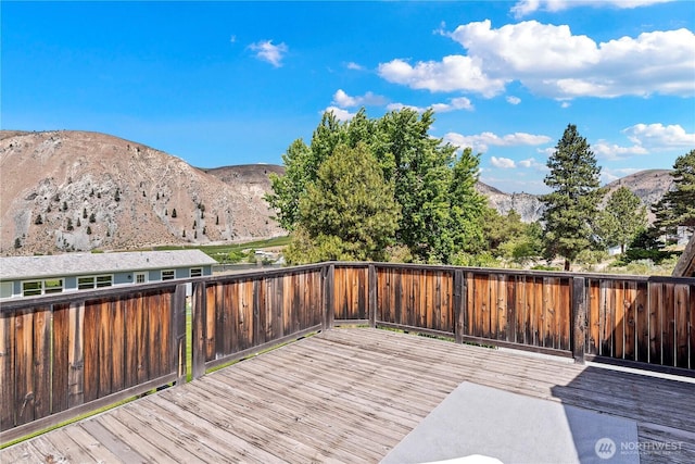 245 Lakeview Ave, Orondo, WA 98843 - wooden deck with a mountain view and a fenced backyard