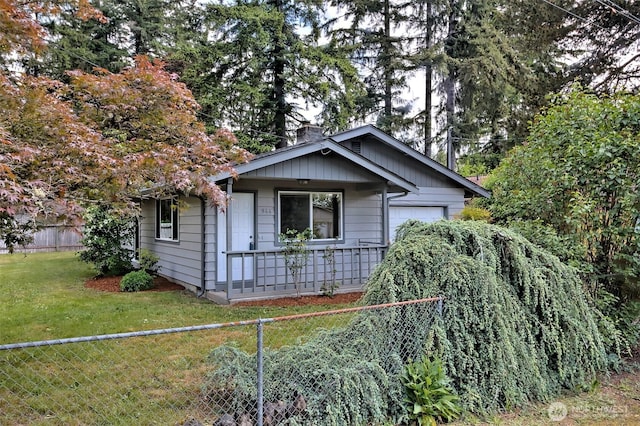 944 Barnhard St, Shelton, WA 98584 - view of front of house with a chimney, covered porch, and a garage