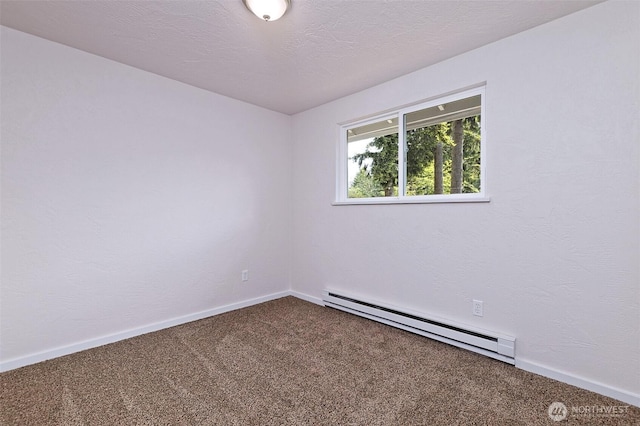 944 Barnhard St, Shelton, WA 98584 - empty room with a baseboard radiator, dark carpet, and baseboards