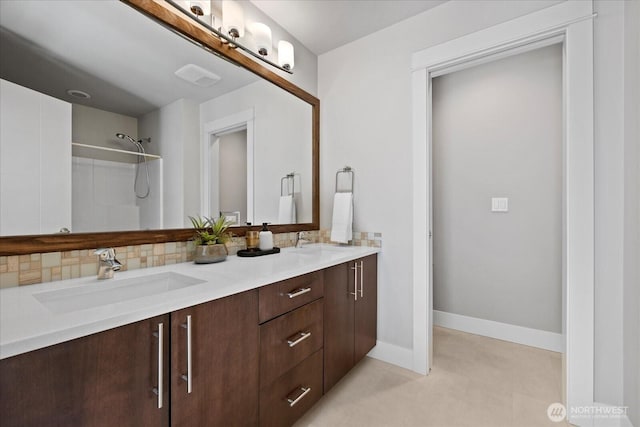 12126NE 106th Pl, Kirkland, WA 98033 - full bathroom featuring double vanity, decorative backsplash, a shower, and baseboards