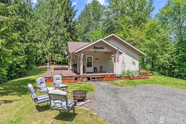 19243 Kiona Rd, Randle, WA 98377 - view of front of property with a fire pit, a front lawn, and a deck